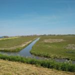 Vanaf de dijk rond het eiland heb je dit mooie uitzicht op Marken.